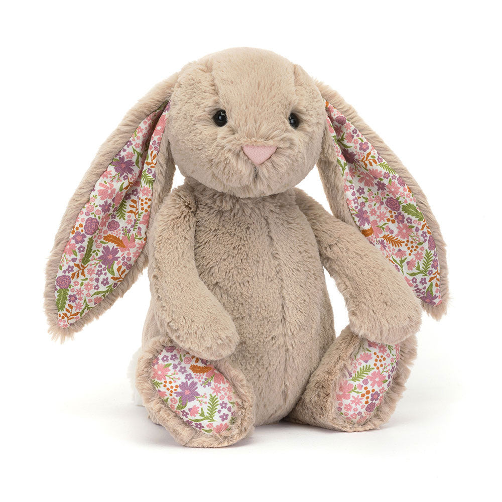 Soft beige Jellycat Blossom Bunny Petal Medium plush toy with floppy ears and embroidered face, perfect for cuddling.