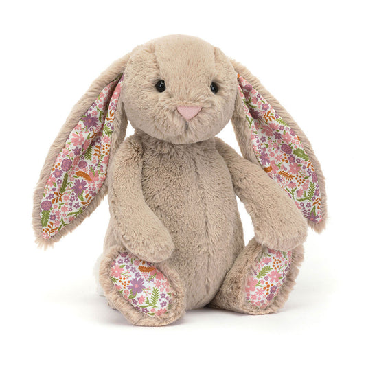 Soft beige Jellycat Blossom Bunny Petal Medium plush toy with floppy ears and embroidered face, perfect for cuddling.
